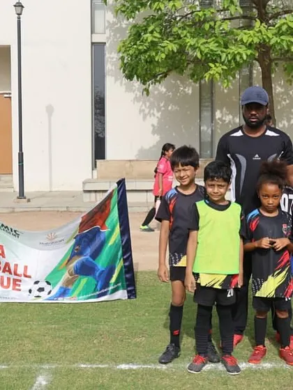 Another team photo with their coach, ready for their league match.