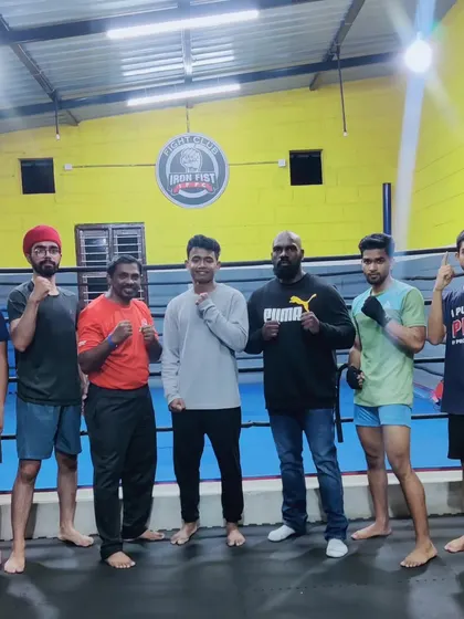 A group of our members with me in the ring. We welcome everyone, from those just starting their fitness journey to experienced martial artists.