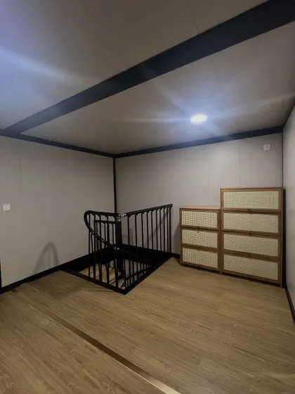 For multi-level modular structures, I incorporate features like this elegant spiral staircase. It's a functional element that also serves as a beautiful design statement.