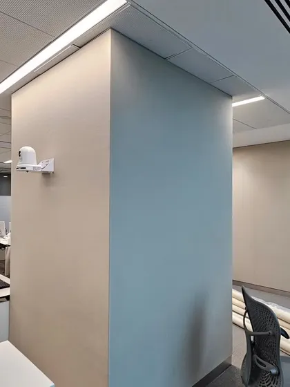 Here you can see fabric being applied to a pillar using a gripper system in a Mumbai office. This technique allows for a flawless, tight finish on both flat and curved surfaces for optimal sound control.