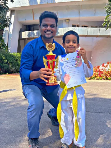 Another one of our young winners from the 7th KTA Cup, proudly holding his trophy and certificate.