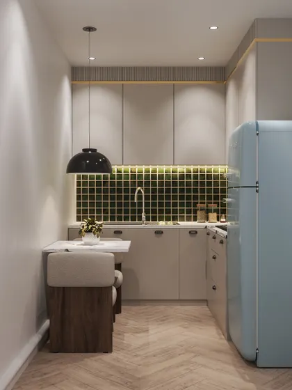 A wider view of the studio kitchen, showing the compact dining nook and demonstrating how to maximize functionality in a limited area.