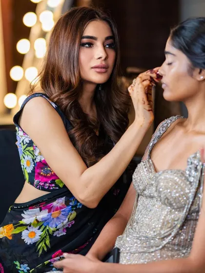 A behind-the-scenes shot of me working on a model. This shows the hands-on nature of my teaching and the attention to detail I bring to every look.