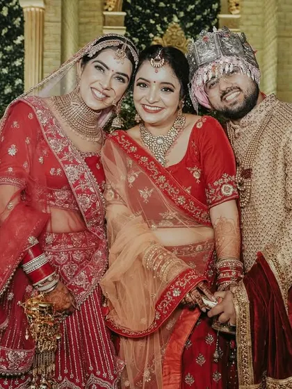 A happy family portrait with the newlyweds. Capturing the couple with their loved ones is just as important as the romantic shots.