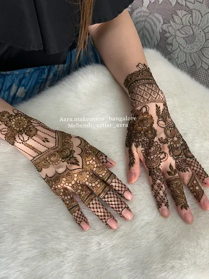 A view of both hands, showing a popular non-bridal design that is different on each hand for a modern look.