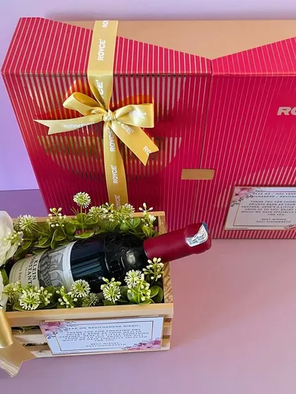 For a truly luxurious corporate gift, we curated this hamper with a bottle of fine wine and a large box of Royce' chocolates.