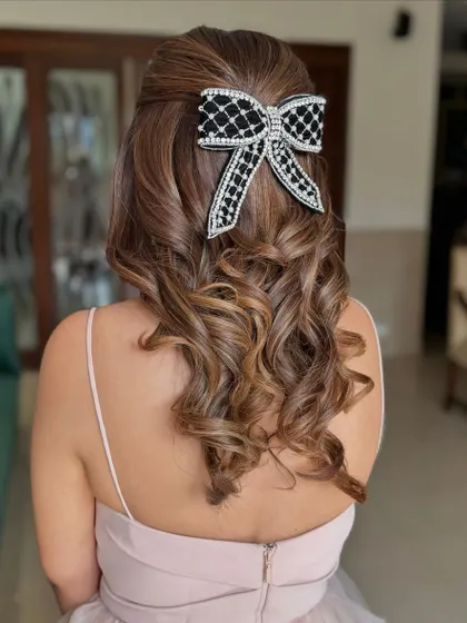 A close-up of the embellished bow, adding a touch of glamour.