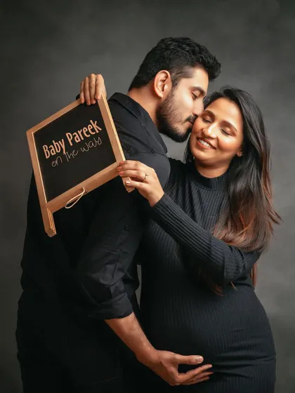 "Baby Pareek on the way!" Using a small chalkboard is a cute and personal way to share your excitement in your maternity photos.