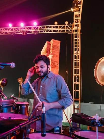 Adjusting my in-ear monitors during a show. Professional sound is crucial, and I make sure I can hear every nuance to deliver the best performance.