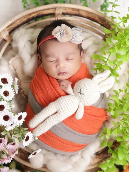A tiny friend for a tiny baby. We often use soft toys like this crocheted bunny to add a sense of scale and extra cuteness to our newborn portraits.