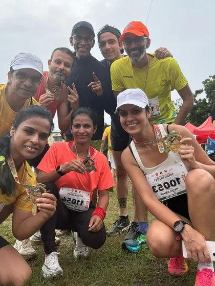 A happy group selfie with finisher medals. The joy and camaraderie after crossing the finish line are what make race days so memorable.