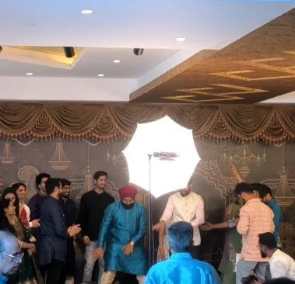 A social event with guests dancing on stage.