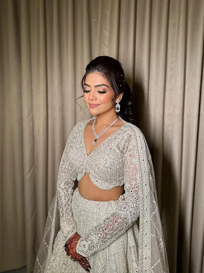 This shot showcases the beautiful blend of the eye makeup and the soft contouring that defines her features.