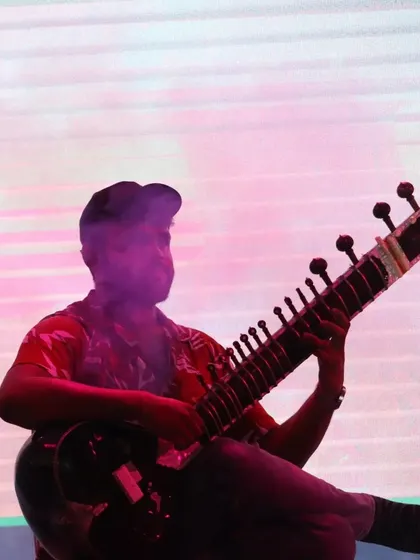 Another silhouette-style photo from a contemporary performance. The lighting creates a mysterious and cool aesthetic.