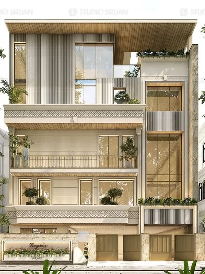 A design for a 300 sq. yard plot in Naraina Vihar, New Delhi. This facade uses a light-colored stone and intricate jali work to create a delicate and sophisticated exterior.
