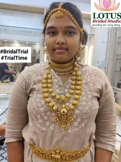 A client trying on a full temple jewellery set during her bridal trial. You can see the choker, haram, and vaddanam coming together for a complete look.