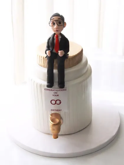 A cake designed for the CEO of Axis Bank, Mr. Amitabh Chaudhry. The design is based on his motto about thinking bigger than a glass, hence the giant jar with a tap.
