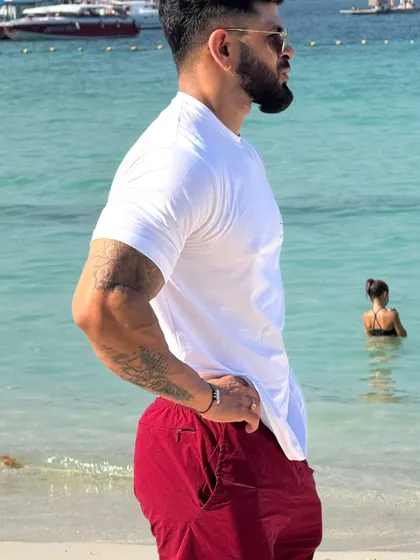 Taking a moment by the water. My programs help you build a physique you're proud to have, whether you're at the gym or on vacation.
