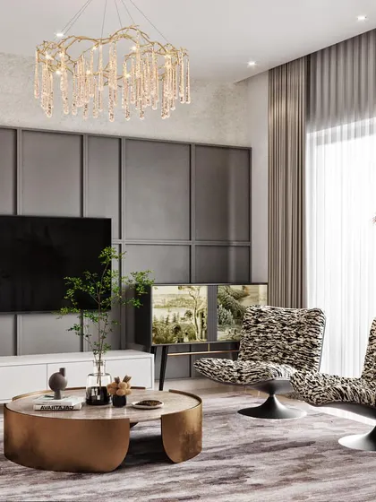 Another angle of the family room, this time focusing on the TV wall with its subtle grey paneling and the unique animal-print accent chairs.