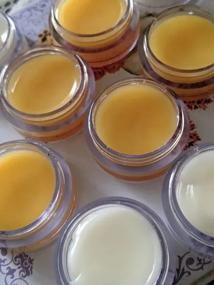 A fresh batch of my handmade lip balms. The yellow is mango flavored and the white is another soothing variety, both made to keep your lips hydrated.