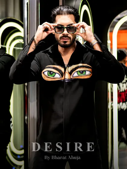 Serving eye-conic looks, literally. This shot captures the playful yet bold attitude of the 'Haters' eyes shirt.