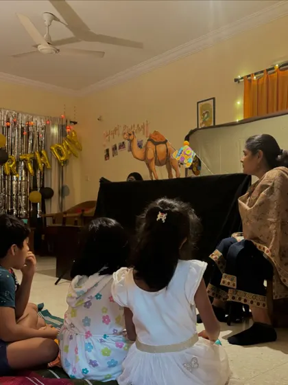 Children gathered for a story and puppet show at a birthday party. Creating these intimate and memorable artistic experiences for small groups is something I deeply enjoy.