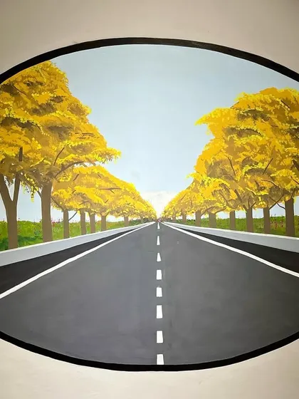 One of the four oval murals, this one depicting a scenic road lined with yellow trees. This piece is meant to inspire the feeling of a long, peaceful city ride.