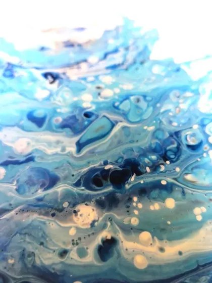 A duplicate of the close-up, this image highlights the beautiful chaos and organic patterns that fluid art can create.