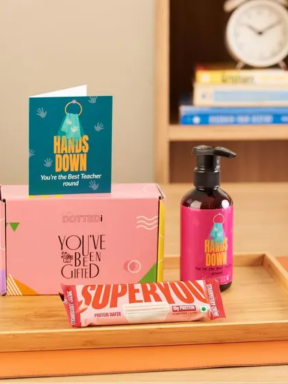 This practical Teacher's Day gift includes a "Hands Down You're the Best" hand soap, a protein bar, and a matching card.
