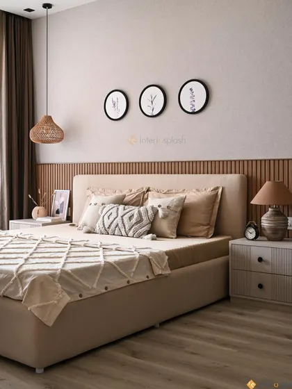 A serene bedroom oasis with a fully upholstered beige bed and a wood-slatted accent wall. The woven pendant light and botanical art prints add a touch of natural, boho charm.