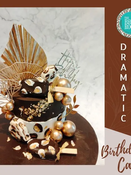 A dramatic and elegant birthday cake. The design combines a leopard print pattern with black and gold details, creating a bold and fashionable statement.