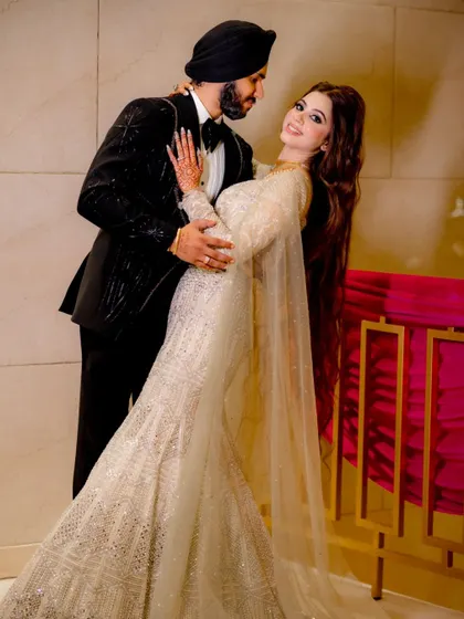 A dynamic dance pose, capturing the fun and energy of the engagement party.