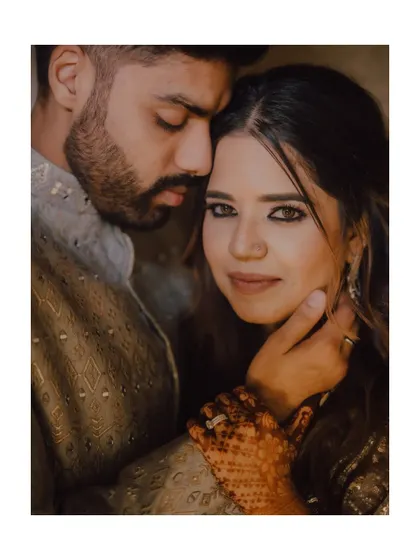 An intimate and soulful portrait from a ring ceremony. The warm lighting and close framing highlight the deep connection and emotion between the couple.