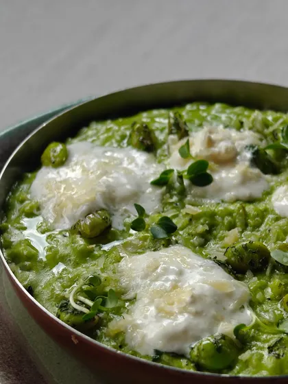 A creamy green pea risotto, dotted with burrata and fresh herbs. It's a comforting bowl of deliciousness.