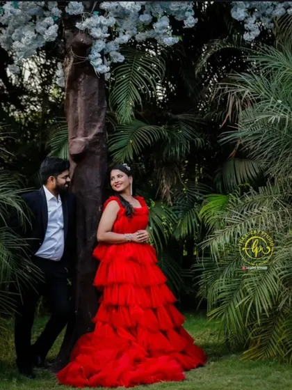 An intimate pose in a lush garden. The classic black suit is a versatile choice that I often recommend for grooms as it works well in any setting.