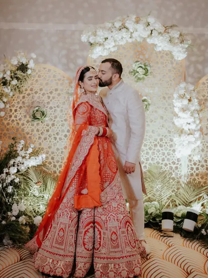 A tender kiss on the forehead, a gesture of love and protection. This is one of those unscripted, in-between moments that we cherish, showing the deep affection shared between the couple.