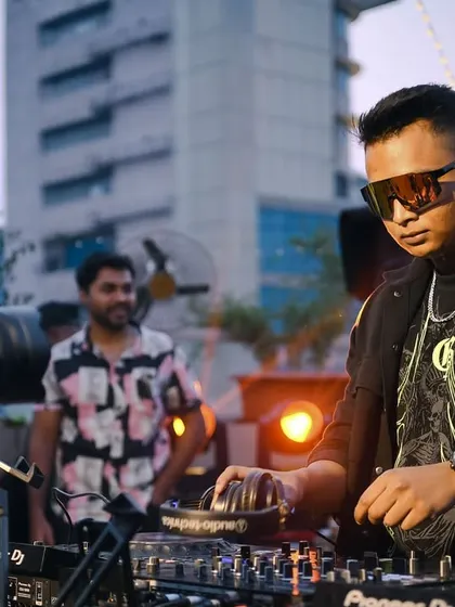 A close-up of DJ Saikat during his daytime set. The focus is always on the music.