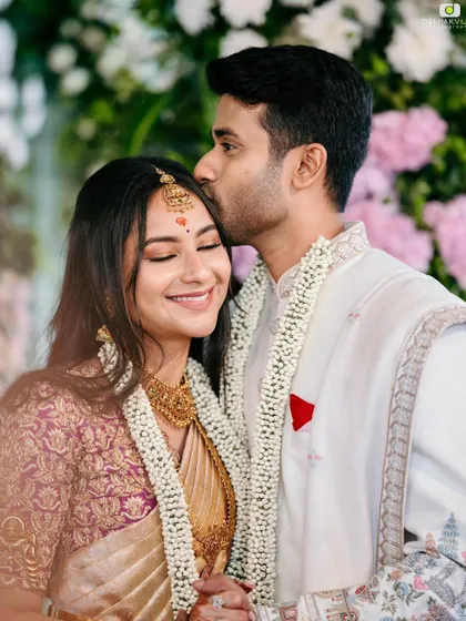 A tender moment from Punya's engagement. Her makeup is soft and romantic, with a focus on natural, glowing skin that looks beautiful in this intimate shot.