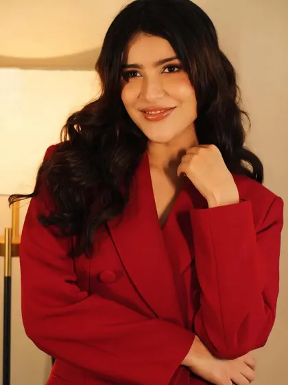 A smiling shot that shows her personality. The makeup is versatile enough to look great whether she's posing seriously or smiling naturally.