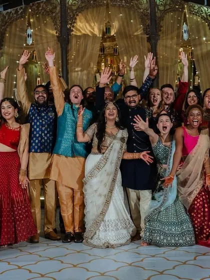 A lively entrance with friends and sparklers. We capture the collective joy and celebration of your Sangeet night, creating images that are full of energy and happiness.