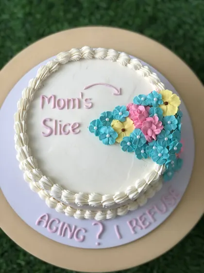 A sweet and funny cake for Mom, with a special slice reserved just for her.