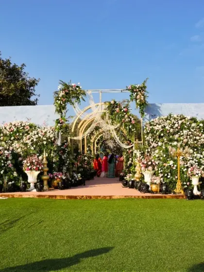 A wide view of the floral entrance, showing how it creates a stunning focal point in the landscape. The design is meant to look like a natural extension of a beautiful garden.