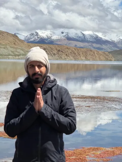Welcoming fellow seekers with a 'namaste' at the banks of Lake Mansarovar. I am here as a fellow traveler, facilitating this journey for our small sangha.
