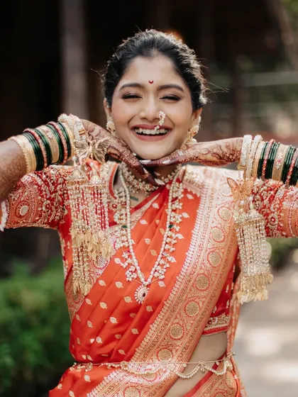 A burst of pure joy captured in a photo of the bride's beautiful, wide smile.