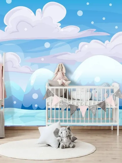 A soft and dreamy wallpaper for a nursery, featuring fluffy clouds against a gentle blue sky. This calming design creates a peaceful and serene environment for a baby.