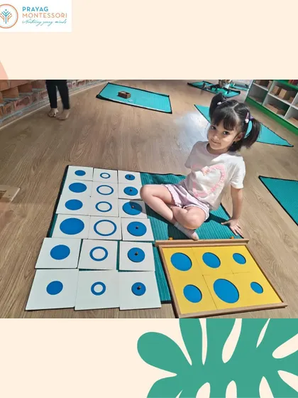 This child is exploring circles of different sizes with the Geometry Cabinet. This activity refines her visual sense and prepares her for reading and writing.