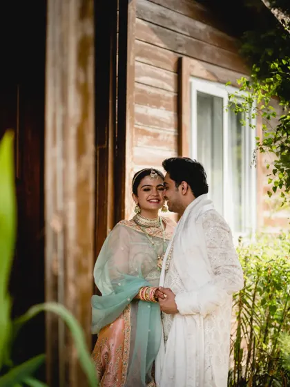 A sweet kiss and a happy smile. This is a beautifully candid moment from Disha and Prateek's couple session.