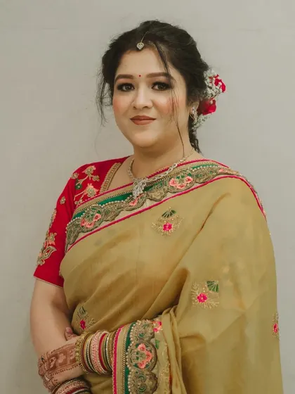 A close-up showing the soft eye makeup and the beautiful hair accessory. Every detail is considered to create a polished look.