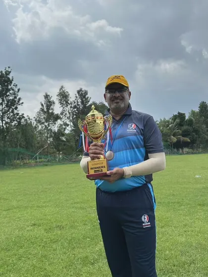 A proud player holding his winner's trophy after a successful tournament. These are the moments we work towards.
