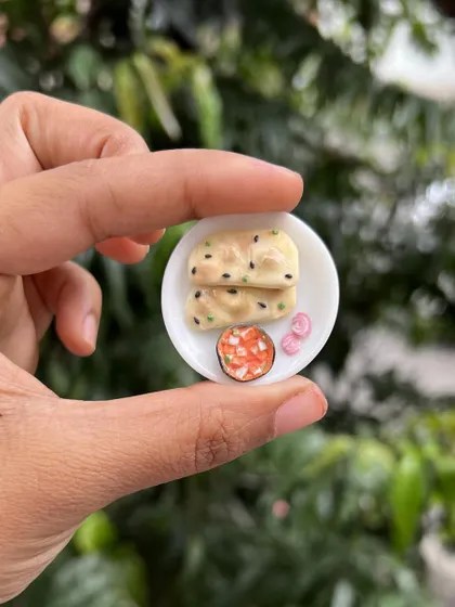 Dinner is served, in miniature form! This tiny plate of roti and paneer curry is a perfect example of the detailed food magnets we create.